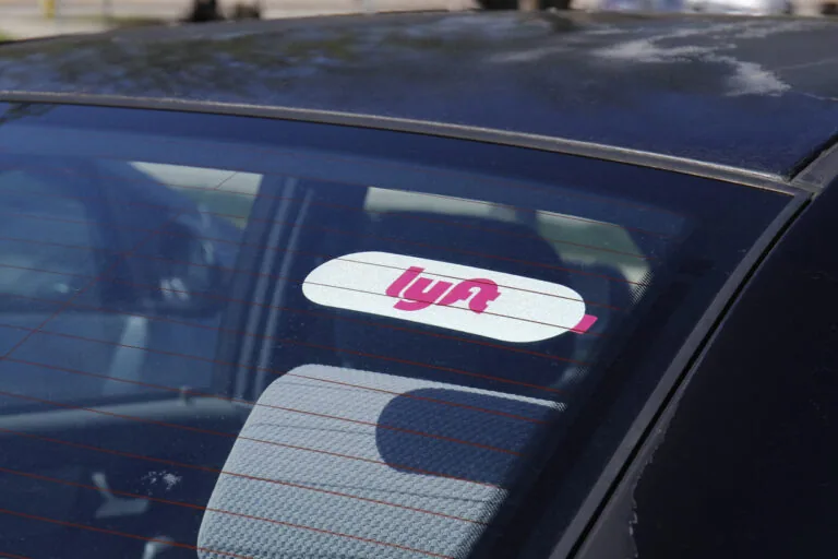 Car for hire with a Lyft sticker.