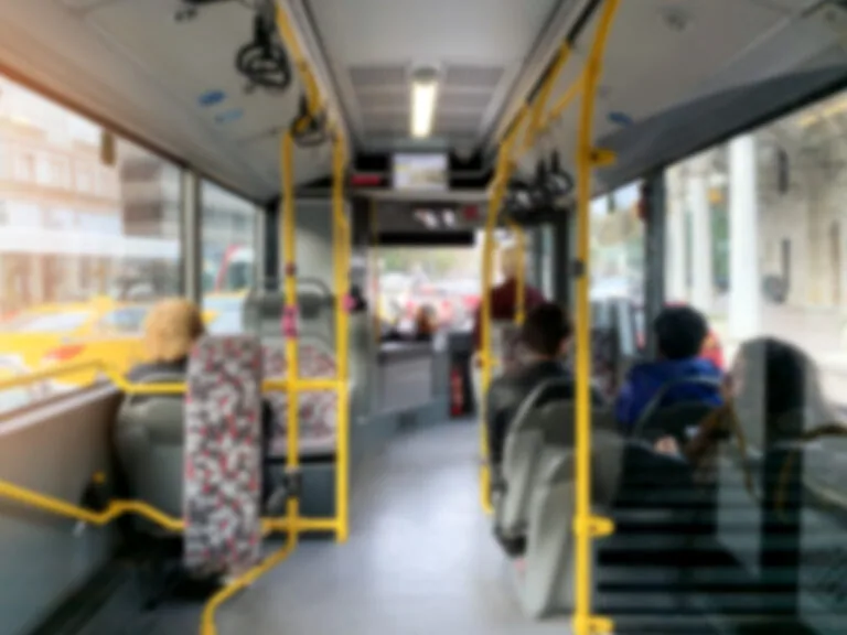 Abstract blurred image background of people on the bus