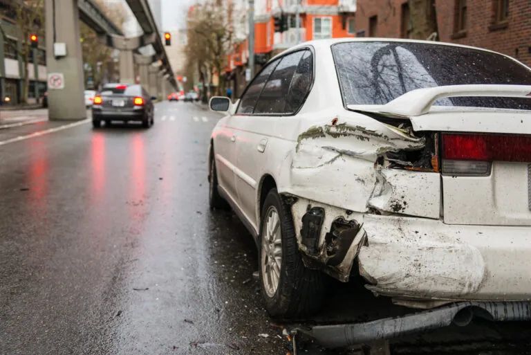 A side swiped white car.