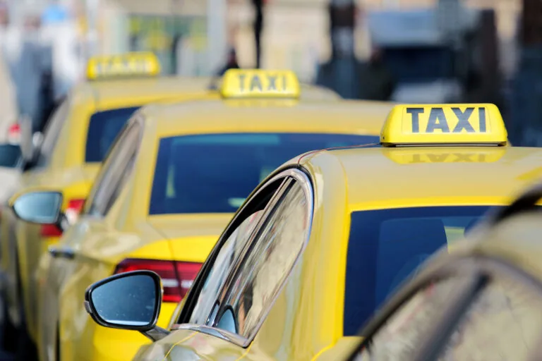 detail of yellow taxi cars on the street
